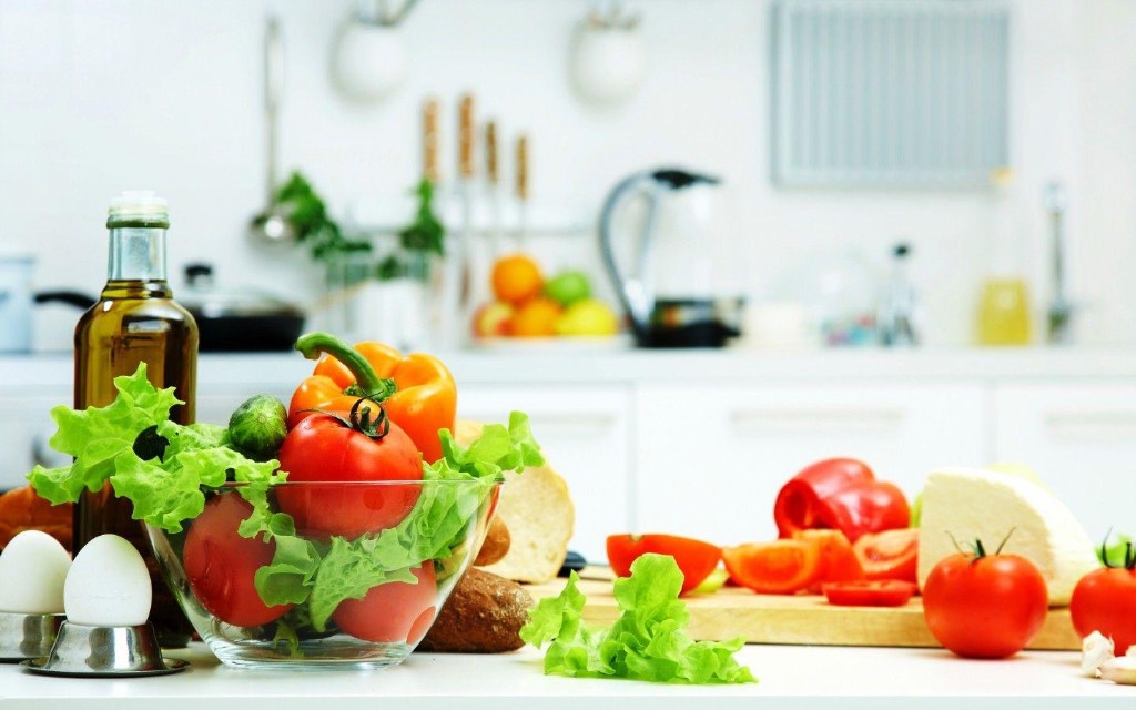 Fresh colourful produce on a bright kitchen counter